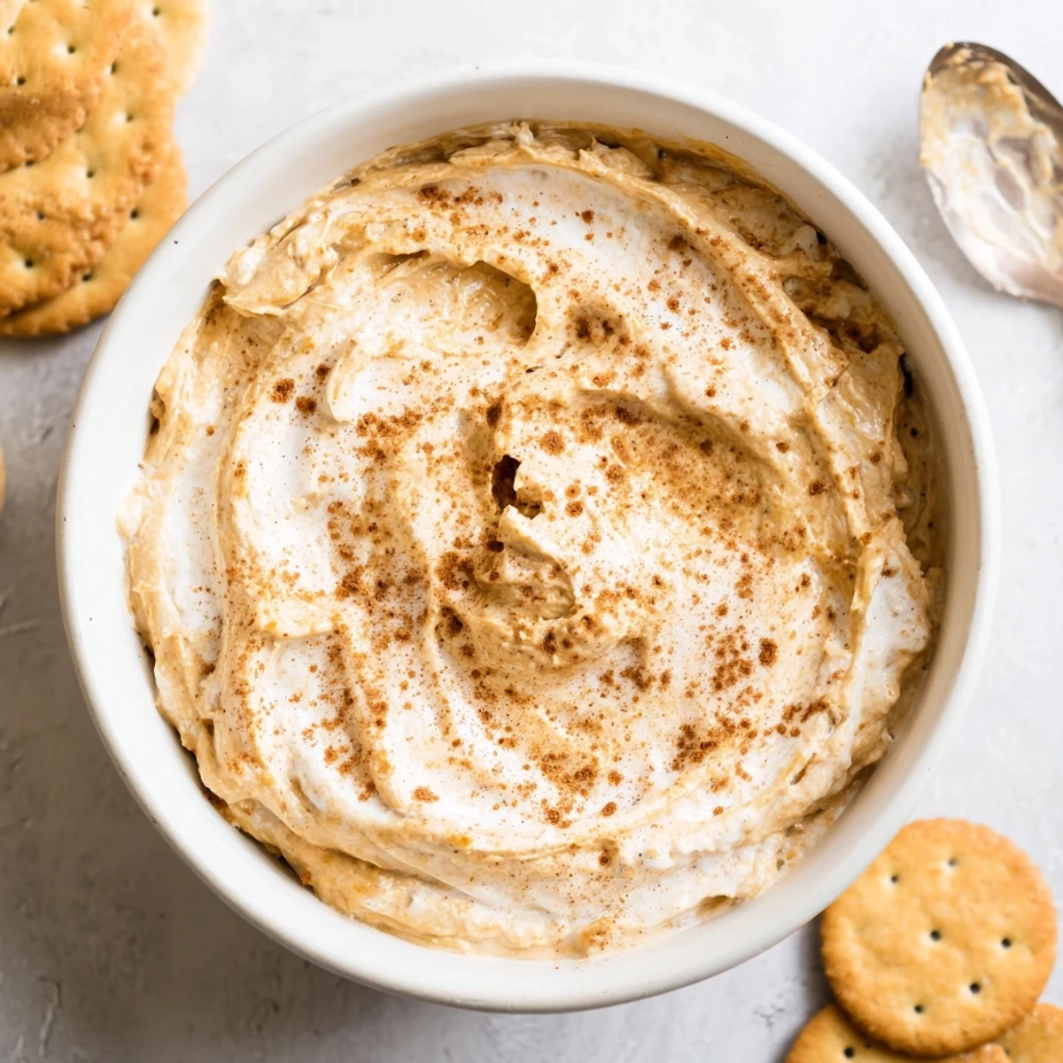 Creamy Thanksgiving Pumpkin Pie Dip served with graham crackers and fresh fruit.  