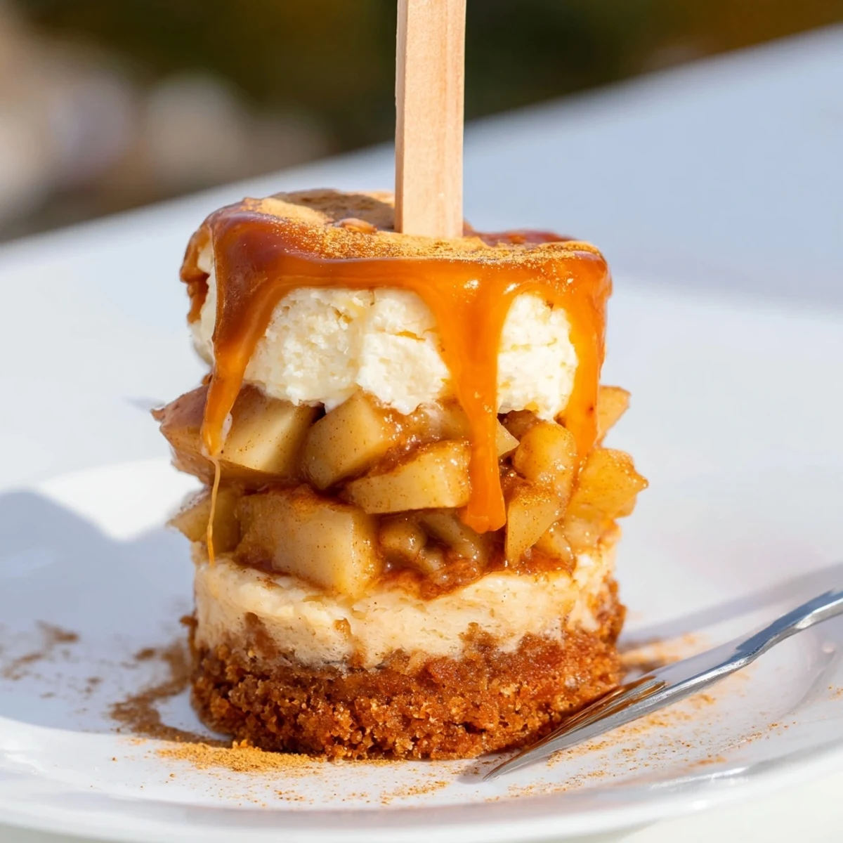 Whimsical muffin skewers featuring tender apples, chai cake, and luscious caramel drizzle.