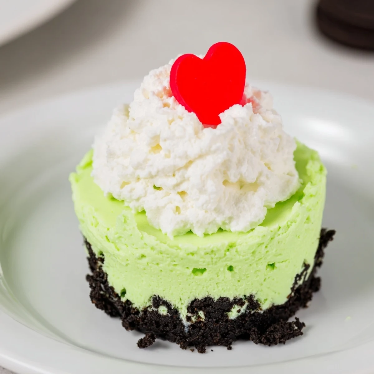 Sweet and festive, these Grinch Mini Cheesecakes are creamy, chilled, and perfect holiday treats.