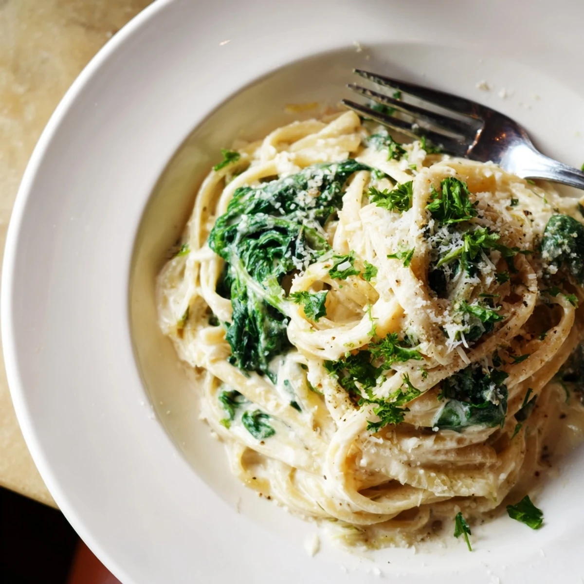 Fresh spinach highlights this comforting Creamy Greek Yogurt Spinach Alfredo Pasta, cooked until perfectly tender.