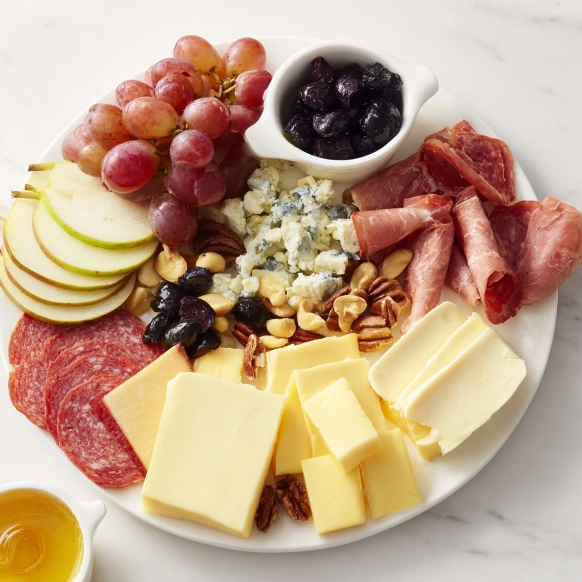 This delicious Moonlight Picnic Board offers a delightful spread of savory cheeses and fresh, vibrant fruits.