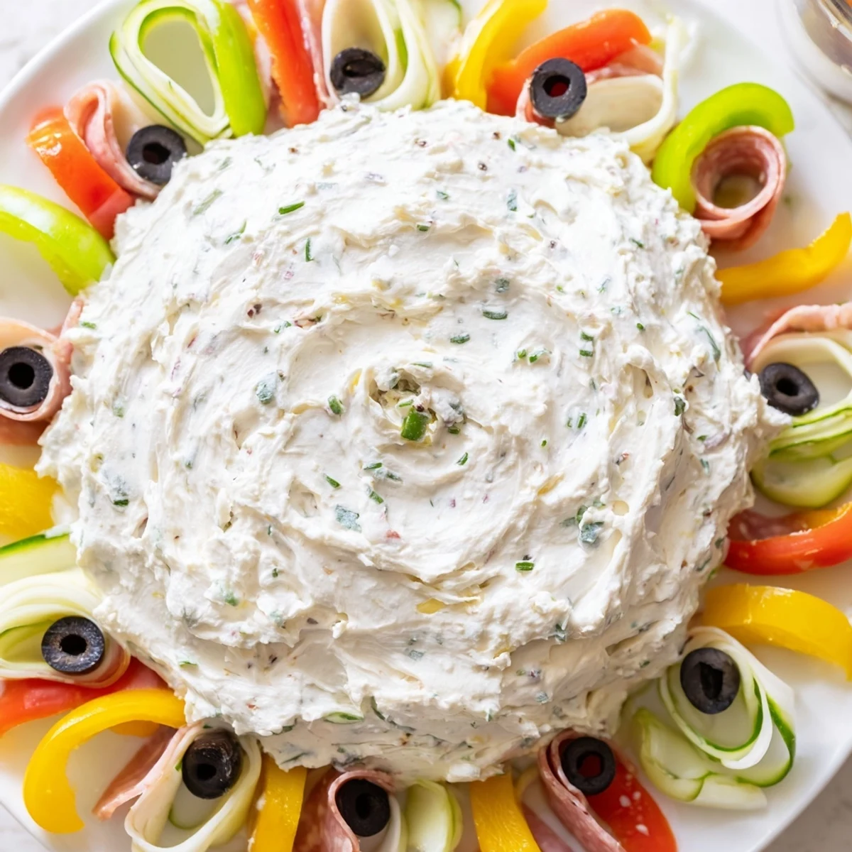 Beautifully arranged Medusa Curls appetizer: prosciutto, salami, and colorful bell peppers create a stunning visual.