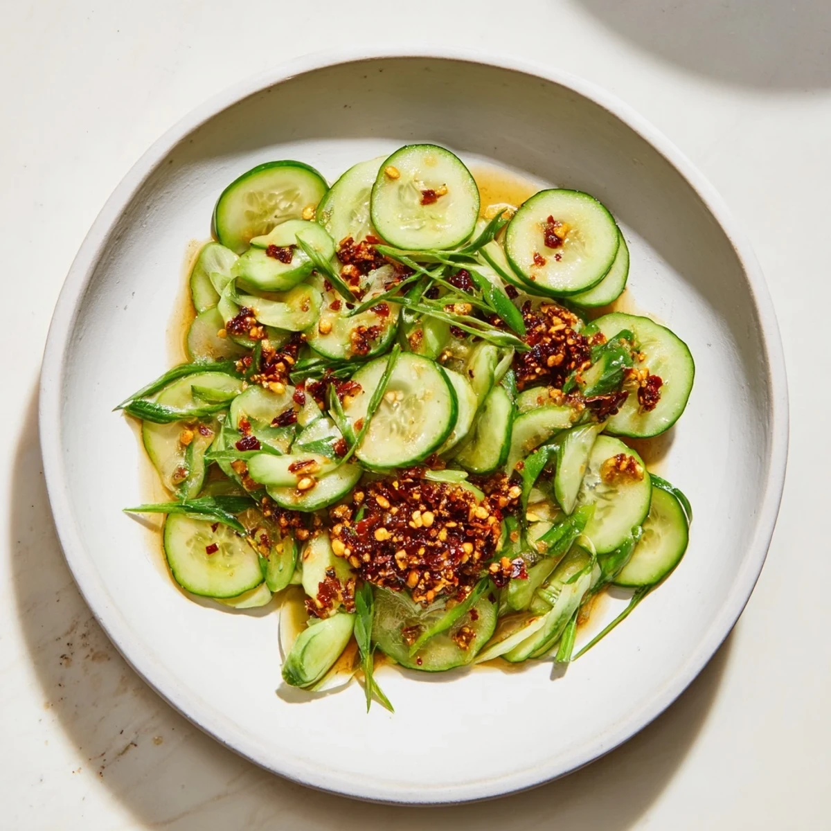 Vibrant colors shine in this Cucumber Shaker Salad, tossed with a spicy chili crisp.
