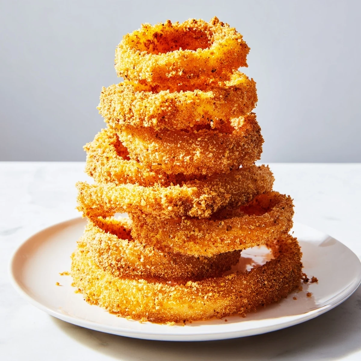 Imagine the perfect crunch: Homemade crispy onion ring tower, expertly fried until perfectly golden.