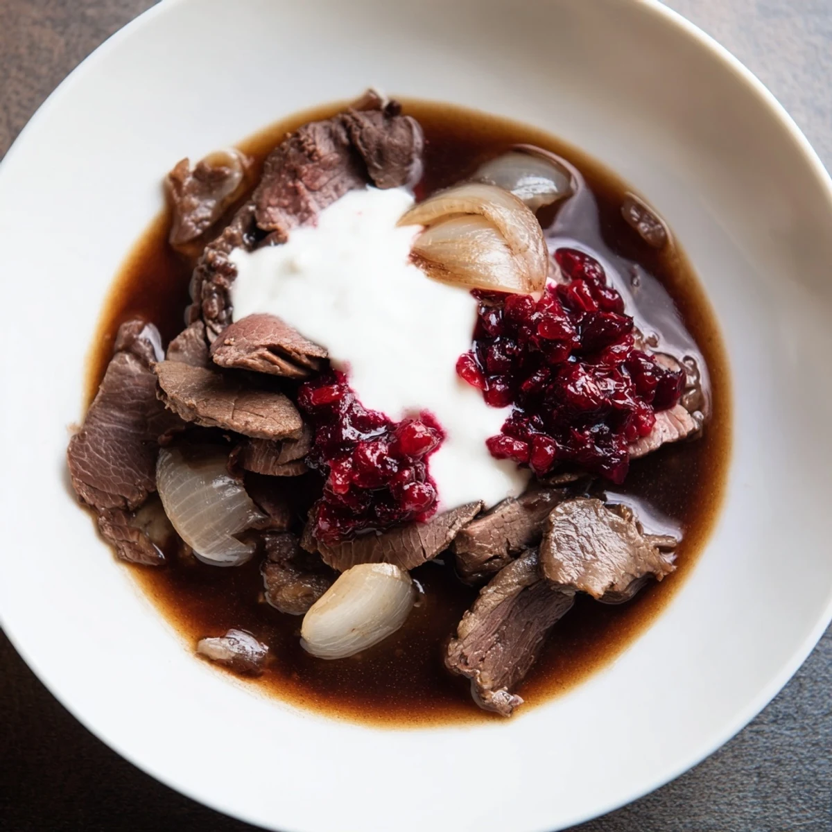 Slow-cooked Finnish Reindeer Stew, rich with savory broth, aromatic onions, and tender, browned reindeer meat.