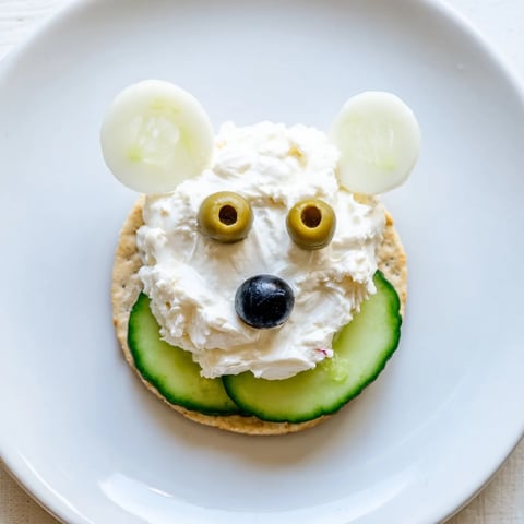 Crisp crackers topped with cream cheese, cucumber iceberg, and delightful Polar Bear Iceberg Cracker Stacks.