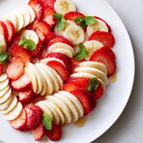 Fresh banana and strawberry candy cane snack, wonderfully colorful and sweet for holiday treats.