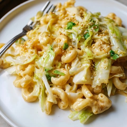 A warm bowl of Mac and Cheese Egg Roll Stir-Fry, garnished with fresh cilantro.
