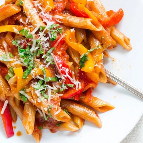 Colorful roasted peppers complement this spicy fall pasta for a delicious meal.  