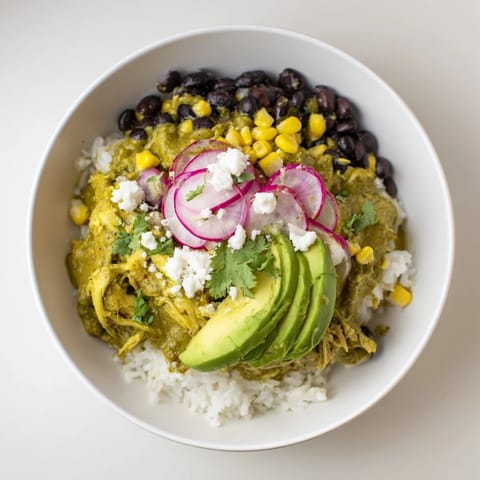 Enjoy a view of a loaded Green Enchilada Rice Bowl, perfect for a gluten-free and flavorful dinner.