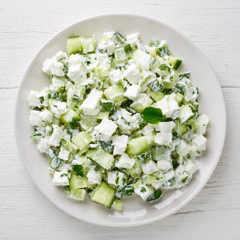 Fresh dill and garlic flavor this light Cucumber and Greek Yogurt Tzatziki Salad, perfect as a side dish.