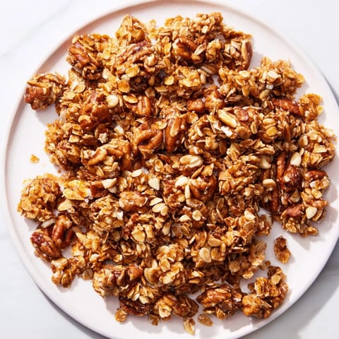 Delectable Honey Nut Granola Clusters offer a sweet, crunchy start to your morning breakfast bowl.