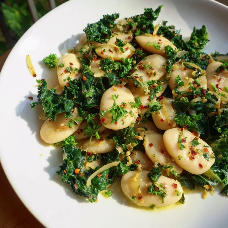 Rustic Garlicky Beans with Winter Greens, a delicious vegan dish featuring wilted greens and creamy beans.