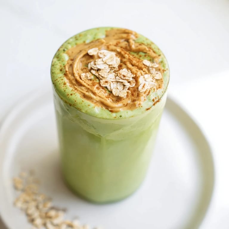 Mouthwatering Matcha Snickerdoodle Protein Shake, served cold, boasts a rich, smooth texture, perfect for a fast, filling breakfast.
