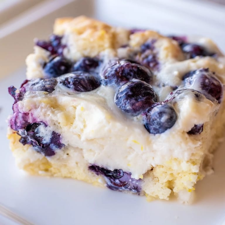 Delicious, high-protein Blueberry Cottage Cheese Bake, dotted with vibrant blueberries, ready to eat!