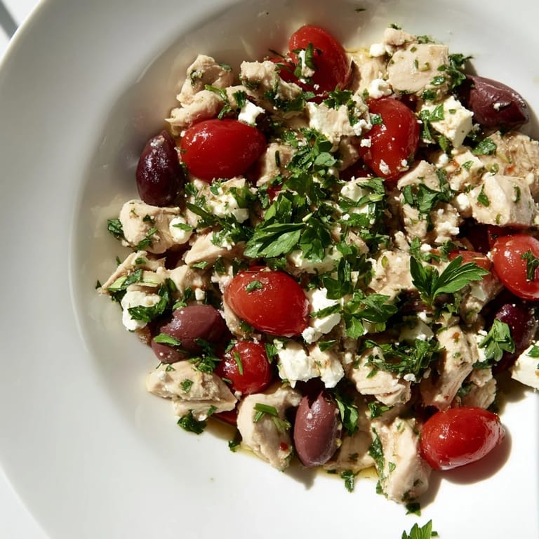 Vibrant Mediterranean Chickpea Chicken Salad served in a white bowl, perfect for a light lunch or summer potluck.